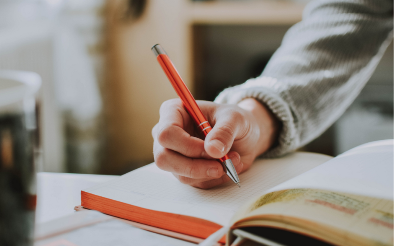 hand writing on a notebook
